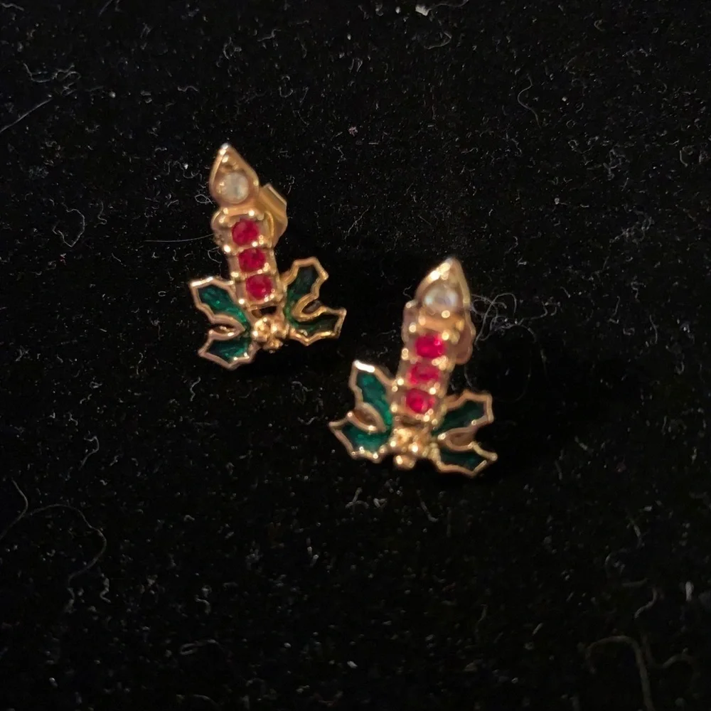 A set of Candles burning in a bed of ivy earrings